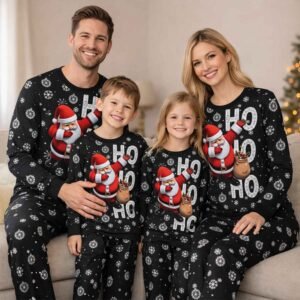 matching family Christmas pajamas with Santa graphic, black fabric with white snowflakes, designed for adults and children, ideal for holiday photos and cozy winter nights
