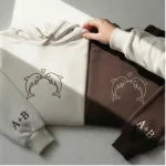 Dolphin Embroidered Hoodie for couples with custom sleeves. Unique gift, emotional design, cozy fit.