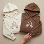 Duck embroidered matching hoodie for couples. Personalized sleeves, cozy fit, perfect Valentine’s Day or anniversary gift.