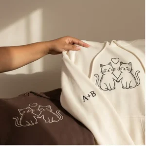 Embroidered cat couple hoodie with custom initials. Cozy, romantic, and perfect for gifting on special occasions.