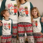 matching family christmas pajamas nutcracker holly jolly set with festive tree and fireplace background