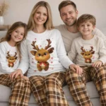 Reindeer design family Christmas pajamas with white tops and brown plaid pants, cozy holiday sleepwear for families.