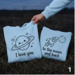 Planet & Rocket embroidered couple hoodies with custom initials. Cozy, personalized, and perfect for romantic gifting.