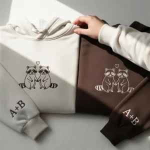 Raccoon embroidered matching hoodie for couples with custom initials. Personalized, cozy, and perfect Valentine’s gift.