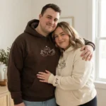 Swans embroidered matching hoodie for couples with custom initials. Romantic design, personalized sleeves, perfect Valentine’s gift.